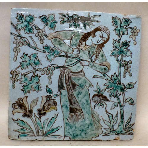 7 - An 18thC Sajavid pottery tile, depicting a figure in a garden&nbsp; 8.25
