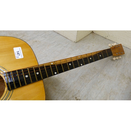 Two six string acoustic guitars