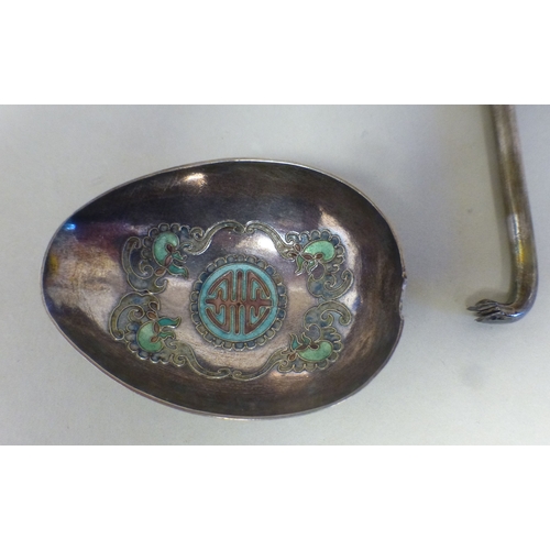 16 - A Chinese silver and enamelled presentation spoon with a stylised dragon handle&nbsp; bears a stamp ... 