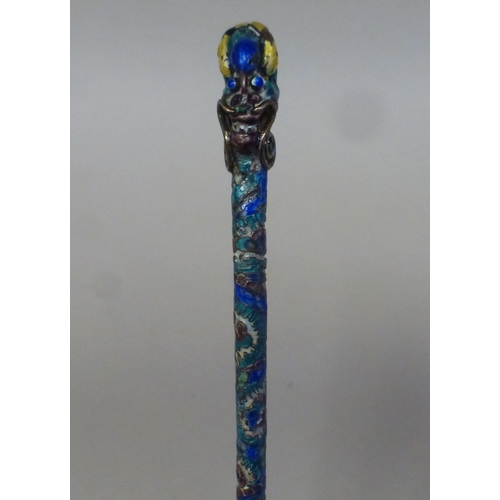 16 - A Chinese silver and enamelled presentation spoon with a stylised dragon handle&nbsp; bears a stamp ... 