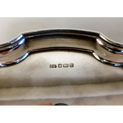 2 - A silver salver with a piecrust border, raised on scrolled feet&nbsp; Sheffield 1990&nbsp; 10