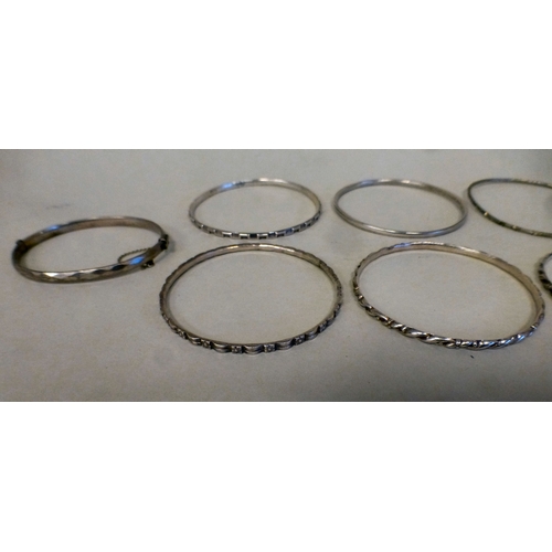 23 - Silver and white metal jewellery: to include bangles
