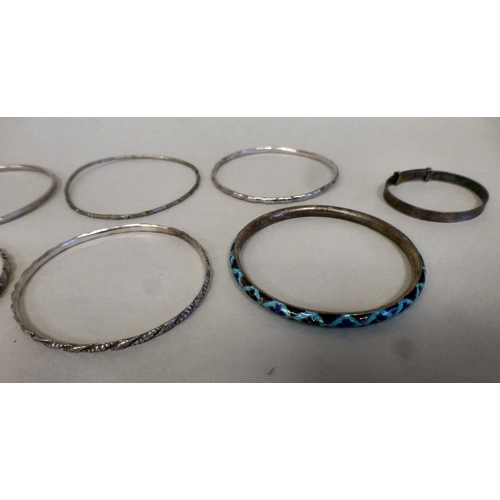 23 - Silver and white metal jewellery: to include bangles