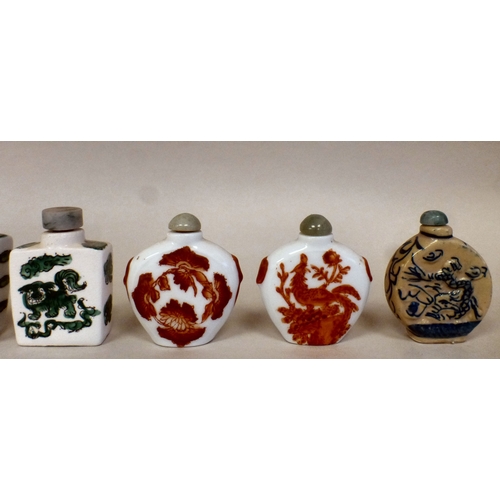 24 - Eight Chinese porcelain and resin scent bottles with various decoration