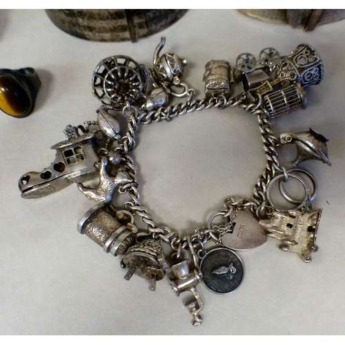26 - Silver and white metal items of personal ornament: to include a charm bracelet; and two bangles