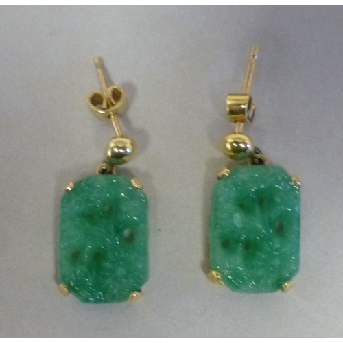 39 - A pair of Chinese yellow metal jade set earrings