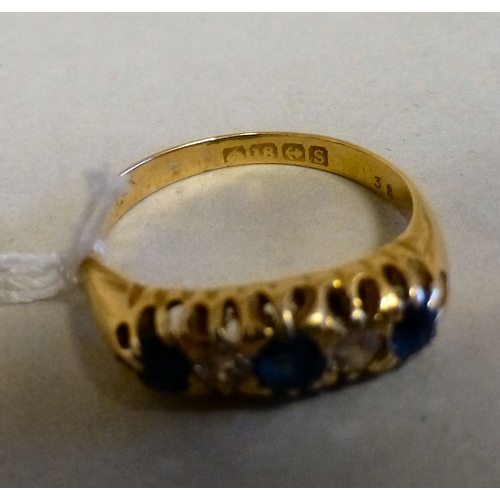 57 - An 18ct gold ring, set with blue stones and alternating diamonds&nbsp; (approx. 4grms)