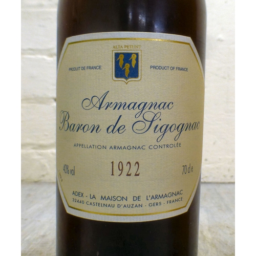 15 - A bottle of Baron de Sigognac Armagnac, in a wooden box; and a bottle of Etiqueta Negra Gran Reserva... 