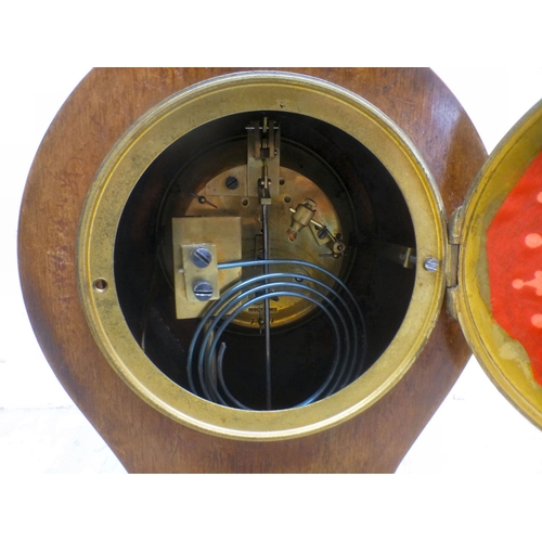 22 - An Edwardian string inlaid mahogany, balloon design mantel clock; the movement faced by a Roman dial... 