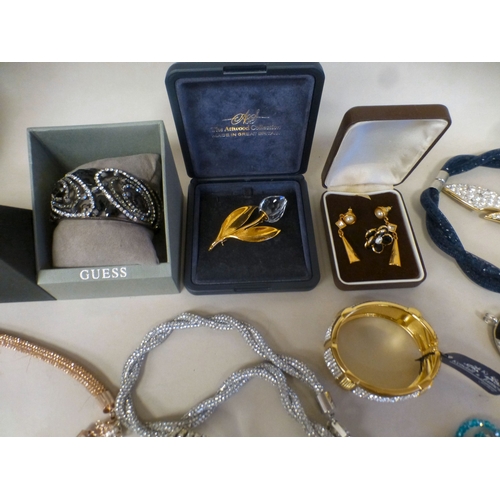 24 - Costume jewellery: to include a Kendall & James gold tone, hinged bangle