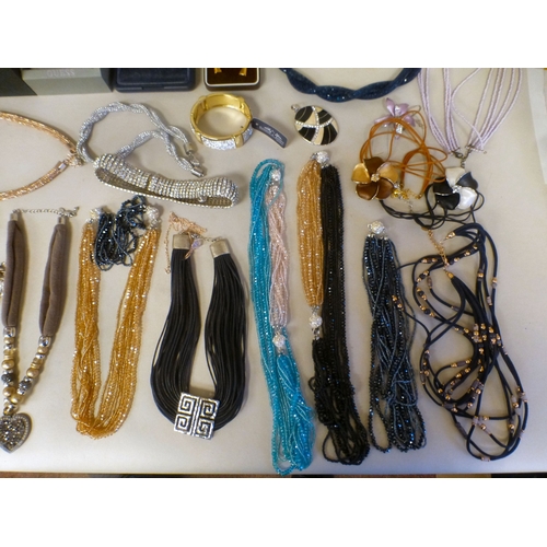 24 - Costume jewellery: to include a Kendall & James gold tone, hinged bangle