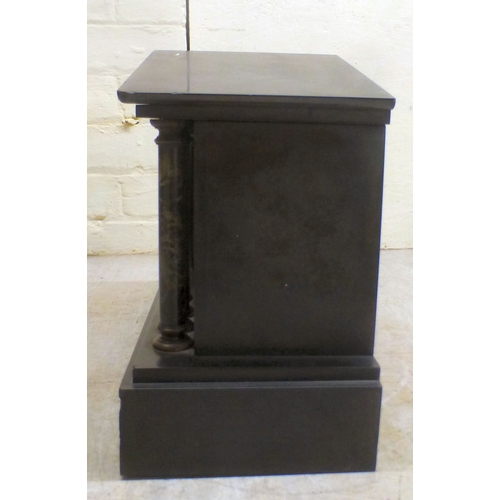 26 - An early 20thC black slate and marble mantel clock of architectural form, on a plinth; the movement ... 