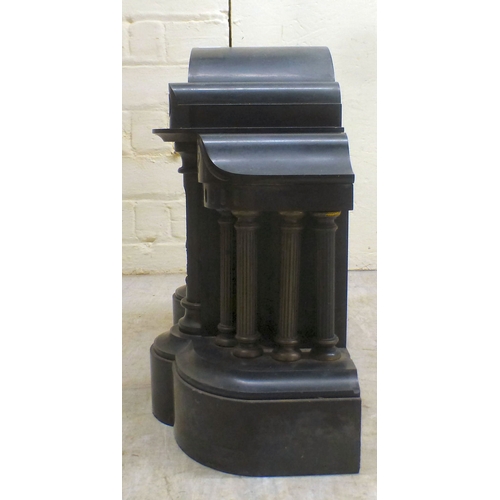 28 - An early 20thC black slate cased mantel clock of architectural form, on a plinth; the movement faced... 