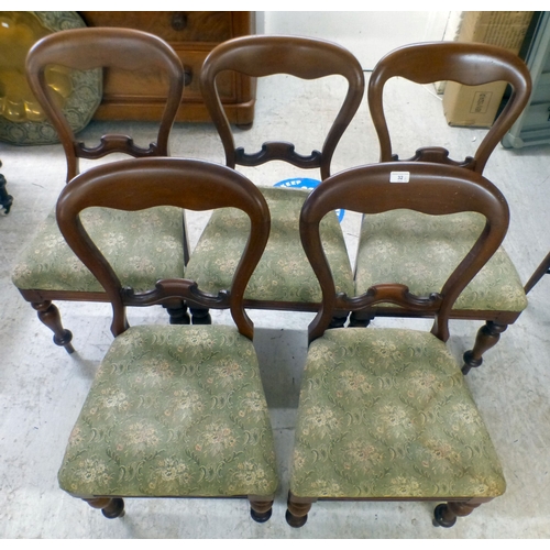32 - A set of five Victorian and later mahogany balloon back dining chairs, the fabric upholstered seats ... 