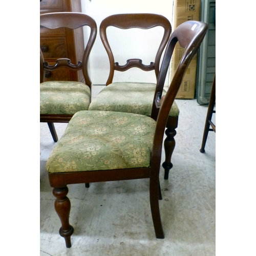 32 - A set of five Victorian and later mahogany balloon back dining chairs, the fabric upholstered seats ... 