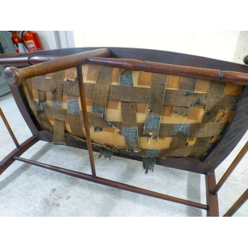 33 - An Edwardian string inlaid mahogany, two person, open arm hall seat, raised on turned legs