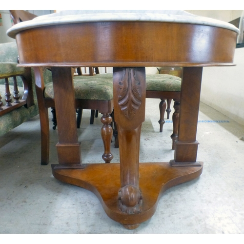 36 - A late Victorian Duchess design mahogany framed marble topped demi-lune washstand, united by cabriol... 