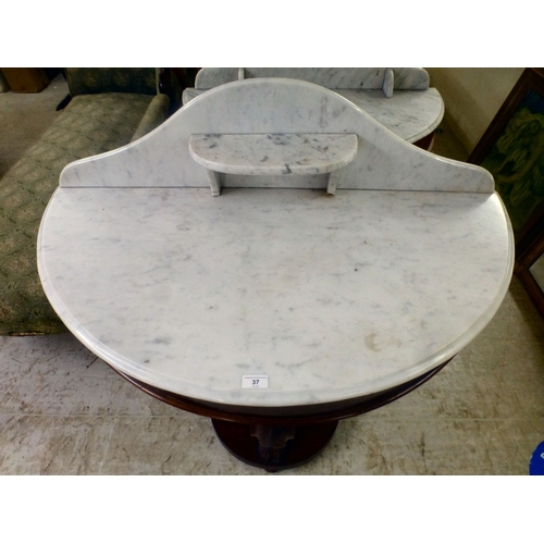 37 - A late Victorian Duchess design mahogany framed marble topped demi-lune washstand, united by cabriol... 