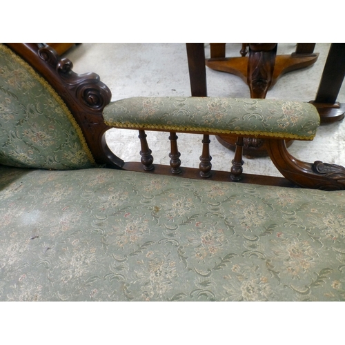 38 - A late Victorian mahogany showwood framed and later fabric upholstered chaise longue, raised on turn... 