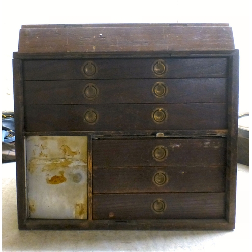 41 - A vintage tool chest with a rising hinged front, enclosing six drawers&nbsp; 13