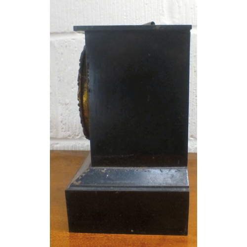 42 - An early 20thC black slate cased mantel clock, on a plinth; the movement faced by an Arabic dial  9.... 