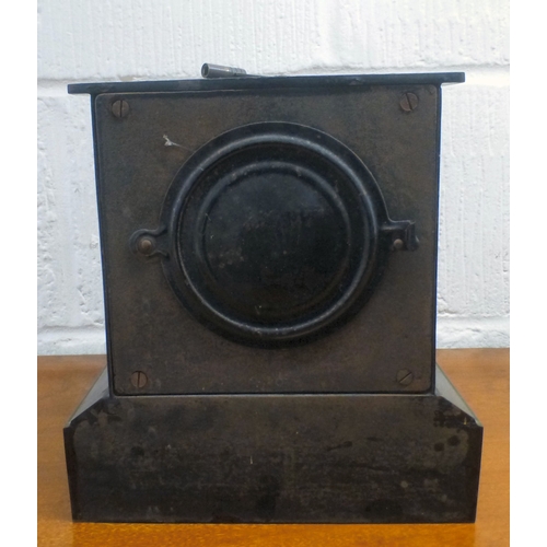 42 - An early 20thC black slate cased mantel clock, on a plinth; the movement faced by an Arabic dial  9.... 