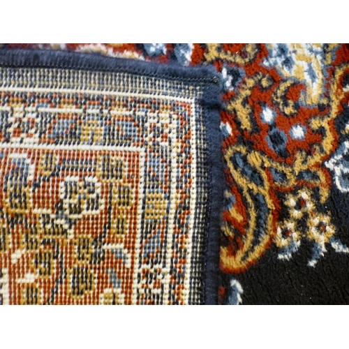 51 - Three machine made rugs&nbsp; various sizes; and another, North Central Persian style prayer mat&nbs... 
