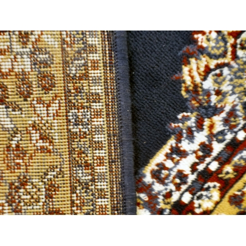 51 - Three machine made rugs&nbsp; various sizes; and another, North Central Persian style prayer mat&nbs... 