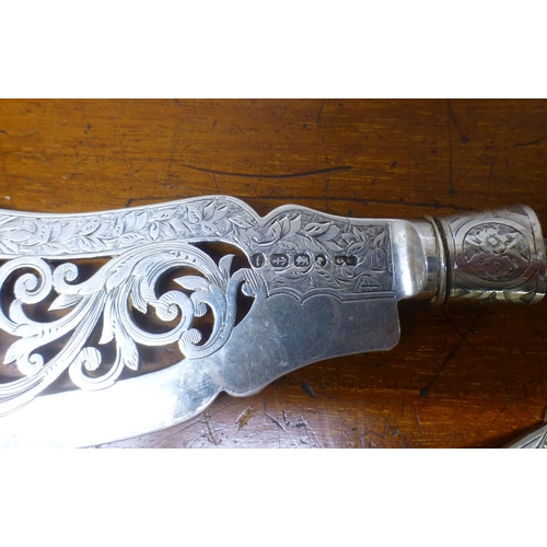 54 - Silver items: to include two late Victorian fish servers&nbsp; (steel pin present and unhandled)
