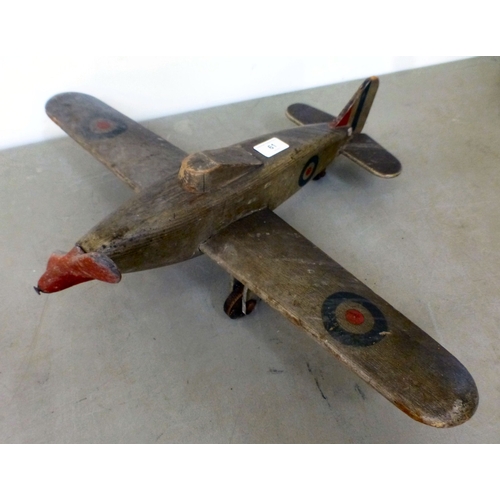 61 - A World War II carved and painted wooden Hawker Hurricane toy aeroplane with a metal propellor&nbsp;... 