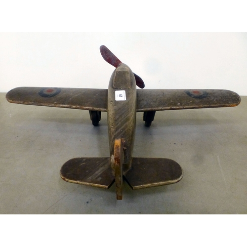 61 - A World War II carved and painted wooden Hawker Hurricane toy aeroplane with a metal propellor&nbsp;... 