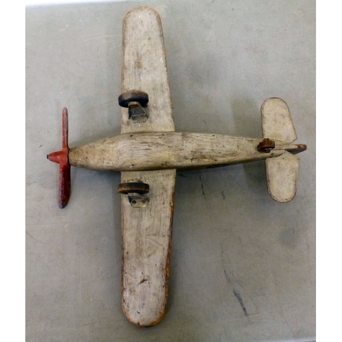 61 - A World War II carved and painted wooden Hawker Hurricane toy aeroplane with a metal propellor&nbsp;... 
