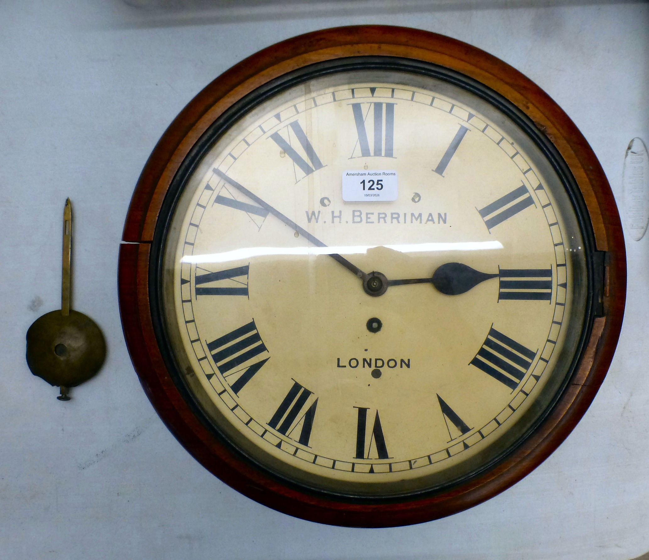 A late Victorian mahogany cased wall clock; the movement faced by a ...