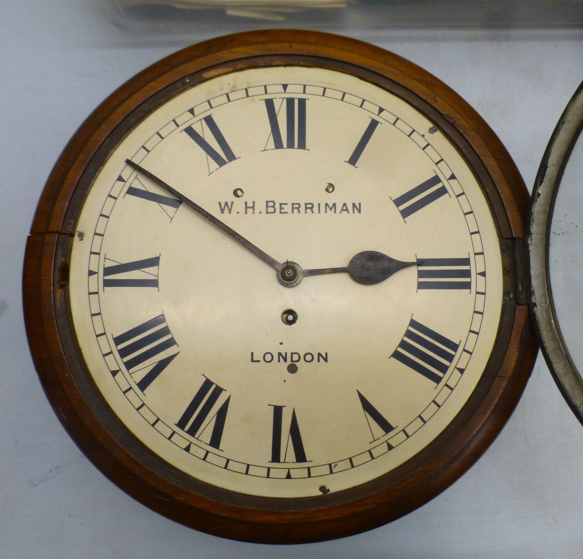 A late Victorian mahogany cased wall clock; the movement faced by a ...