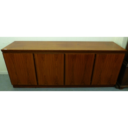 12 - A mid 20thC Danish Skovby rosewood sideboard with four cupboard doors, enclosing interior shelves an... 