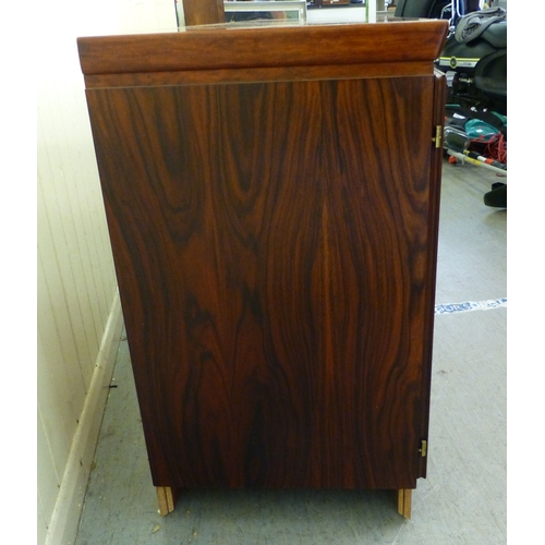 12 - A mid 20thC Danish Skovby rosewood sideboard with four cupboard doors, enclosing interior shelves an... 
