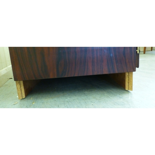 12 - A mid 20thC Danish Skovby rosewood sideboard with four cupboard doors, enclosing interior shelves an... 