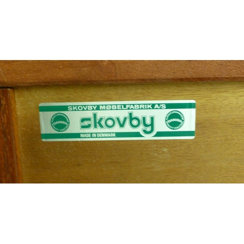 12 - A mid 20thC Danish Skovby rosewood sideboard with four cupboard doors, enclosing interior shelves an... 