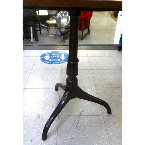 16 - A George III mahogany pedestal table, the tip-top raised on a tripod base&nbsp; 28
