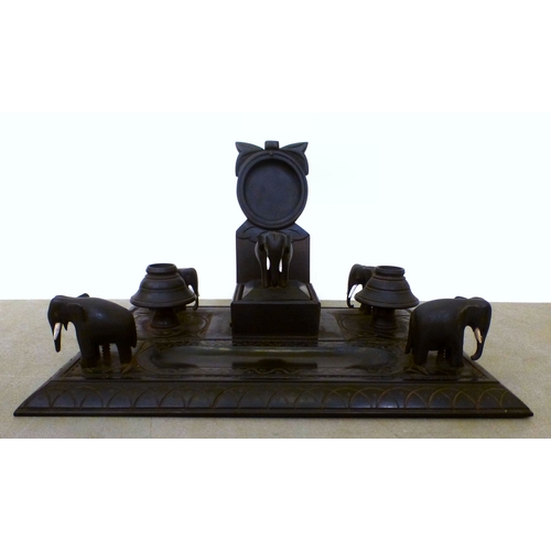 22 - Anglo Indian collectables: to include an early 20thC fruitwood serving tray with opposing brass hand... 