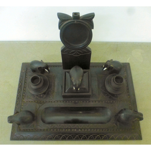 22 - Anglo Indian collectables: to include an early 20thC fruitwood serving tray with opposing brass hand... 