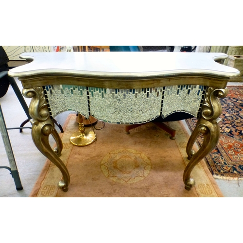 27 - A modern serpentine front console table with silver sprayed finished and mirrored mosaic decoration,... 