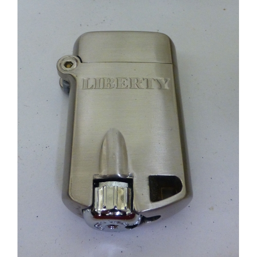 309 - A mixed lot: to include a Thomas & Williams brass Tilley lamp  10