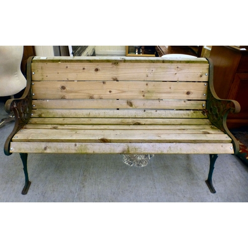 49 - A cast metal framed garden bench with pine slats&nbsp; 28.5