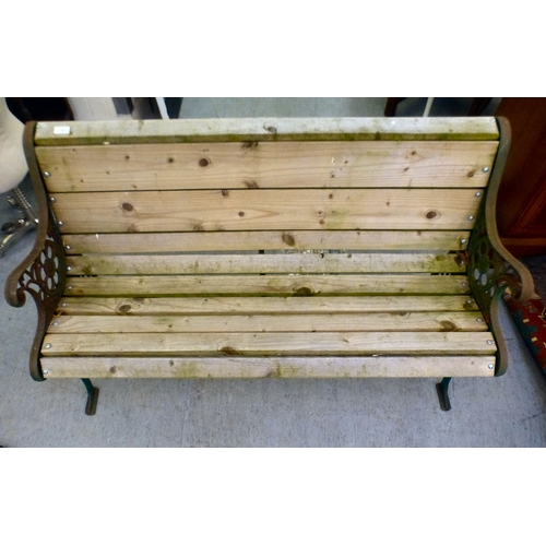 49 - A cast metal framed garden bench with pine slats&nbsp; 28.5