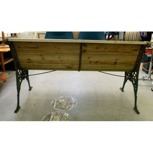 49 - A cast metal framed garden bench with pine slats&nbsp; 28.5