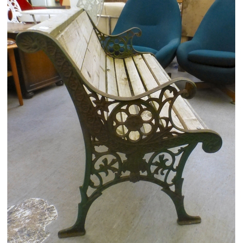 49 - A cast metal framed garden bench with pine slats&nbsp; 28.5