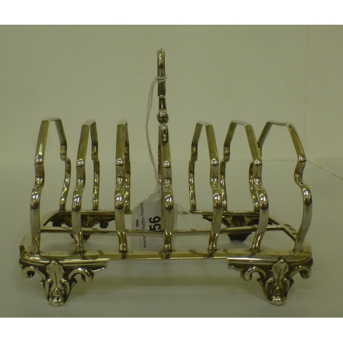 56 - A mid Victorian silver six division toastrack, on scrolled feet&nbsp; London 1852&nbsp; (approx. 275... 
