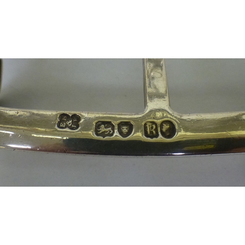 56 - A mid Victorian silver six division toastrack, on scrolled feet&nbsp; London 1852&nbsp; (approx. 275... 