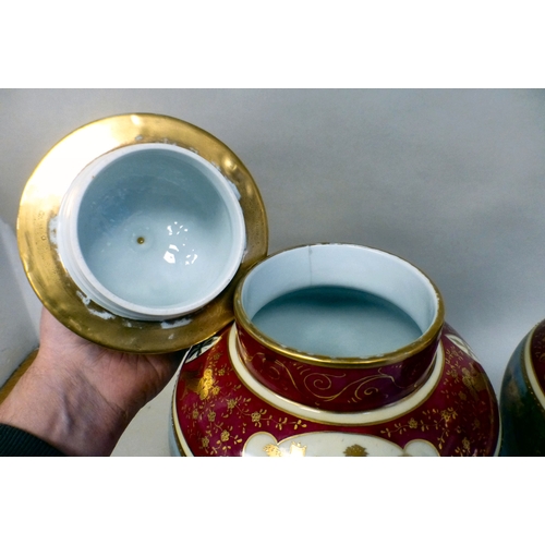 101 - A pair of European lidded vases of bulbous form, each decorated in gilt and red with classical scene... 